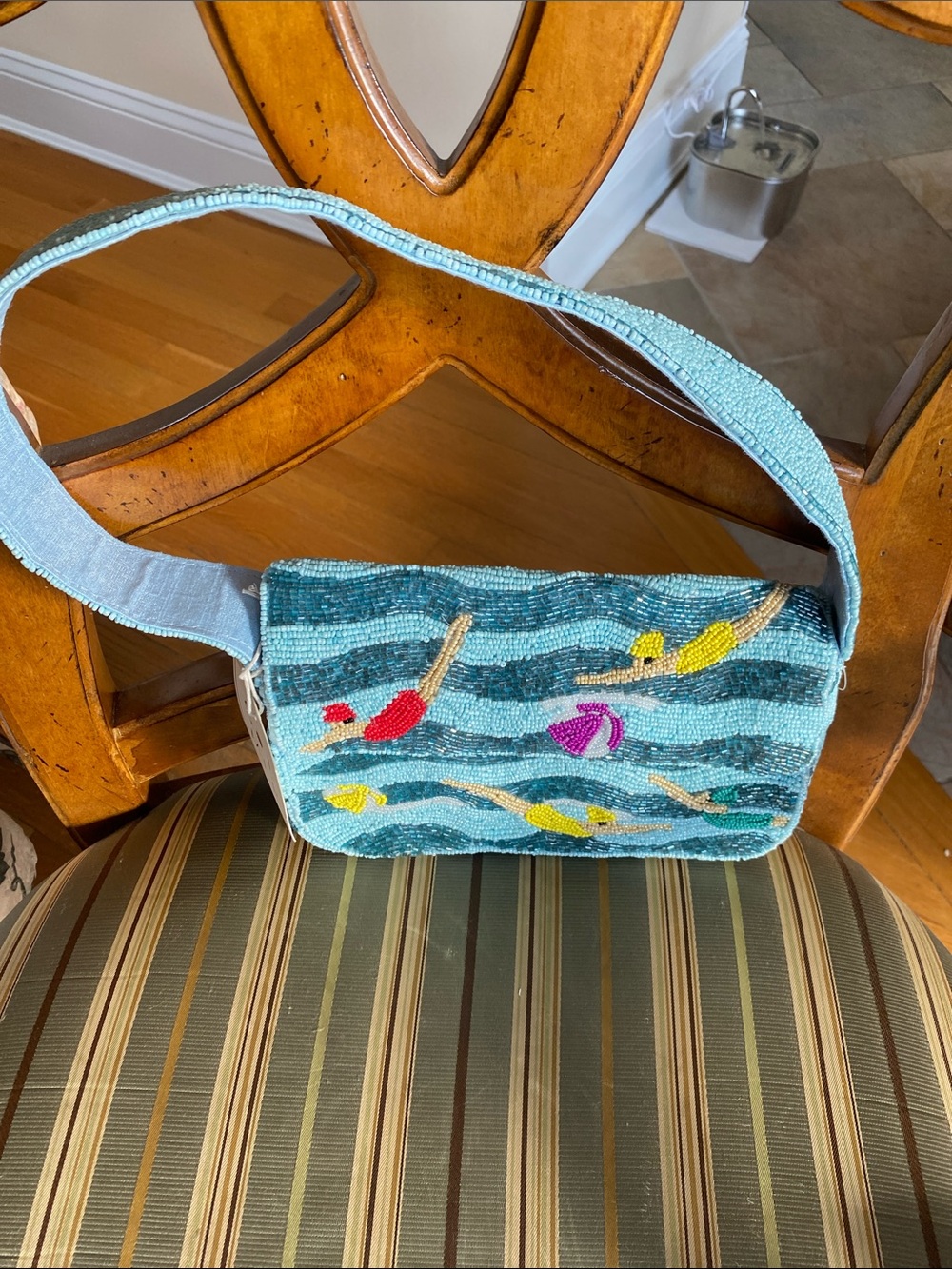 NWT Hand-Beaded light blue with different colors.